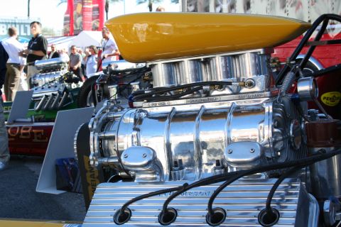 1998 Ford Crown Victoria - A highly polished supercharger dominates the foreground, with another engine visible behind it.