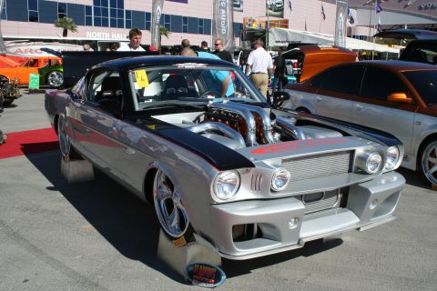 1998 Ford Crown Victoria - Customized classic car with a powerful V12 engine on display at an outdoor event.