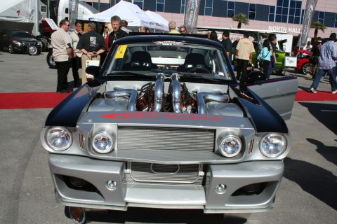 1998 Ford Crown Victoria - This heavily modified vehicle features a custom front end and a prominent, exposed twin-engine setup.