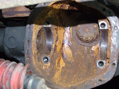 1967 Ford Bronco - The differential cover shows significant rust and wear, obscuring any specific vehicle identification.
