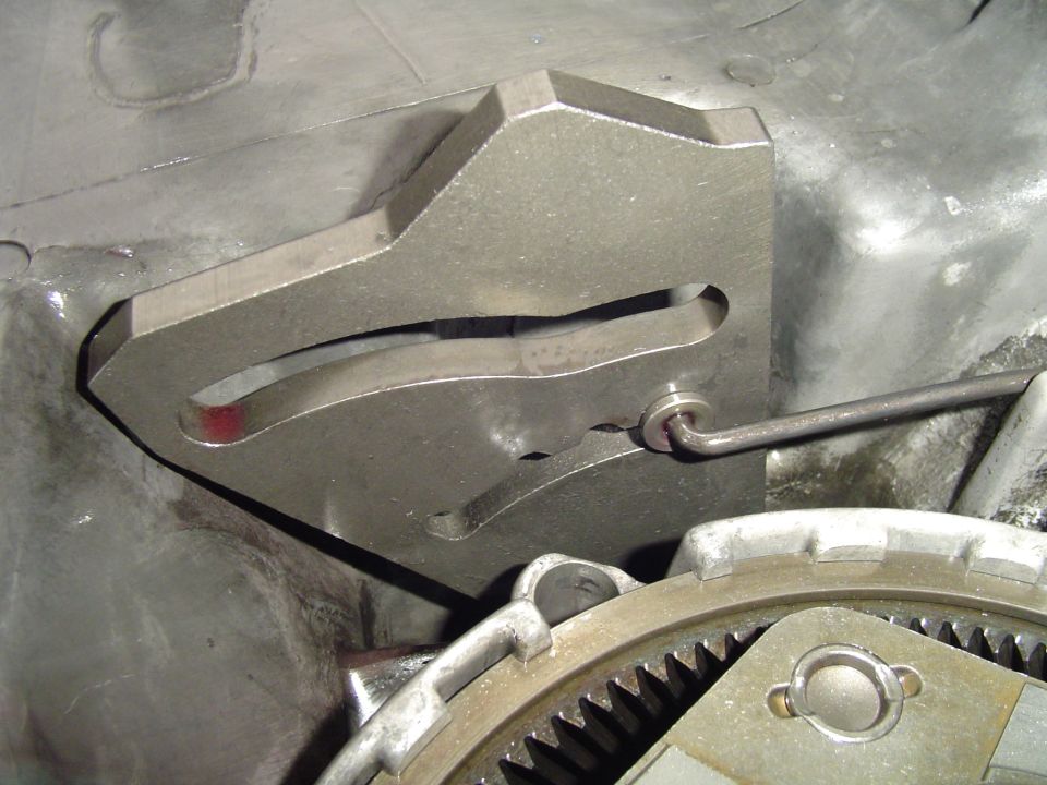 Metal special-tool fixture installed over a ring gear underneath