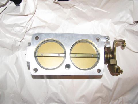 2003 Mercury Marauder - A BBK Twin 65MM Throttle Body is shown, wrapped in white paper. The registry claims it is for a 2003 Mercury Marauder, but this is unconfir…