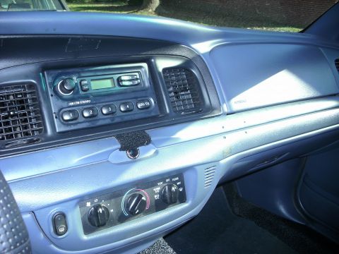 2001 Ford Crown Victoria - Interior view of a 2001 Ford Crown Victoria dashboard, showing the radio and climate control panel.