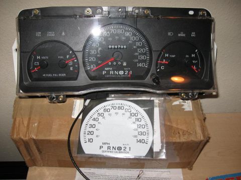 2000 Ford Crown Victoria - Instrument cluster with odometer reading 64,796 miles, shown with a spare faceplate.