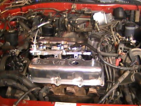 1990 Ford Probe - Close-up view of an engine bay a chrome valve cover with "3.0 VE" visible.