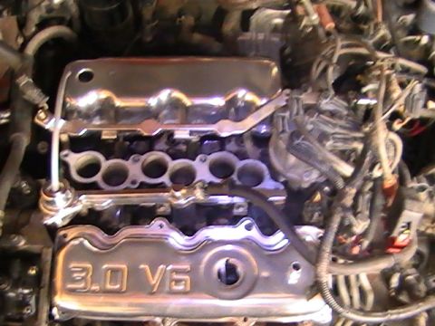1990 Ford Probe - Close-up of a 3.0 V6 engine, likely from a Ford vehicle, with chrome valve covers.
