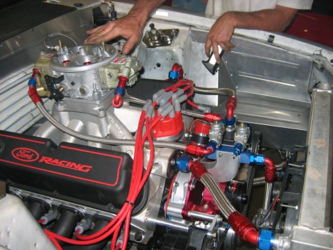 1992 Ford Mustang - Close-up of a modified engine bay Ford Racing valve covers and custom fuel lines.