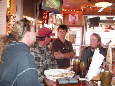 1996 Ford Bronco - A group of friends enjoys a meal and drinks at a bar.