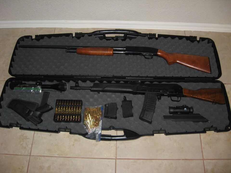 Shotgun and rifle with ammunition in a black case