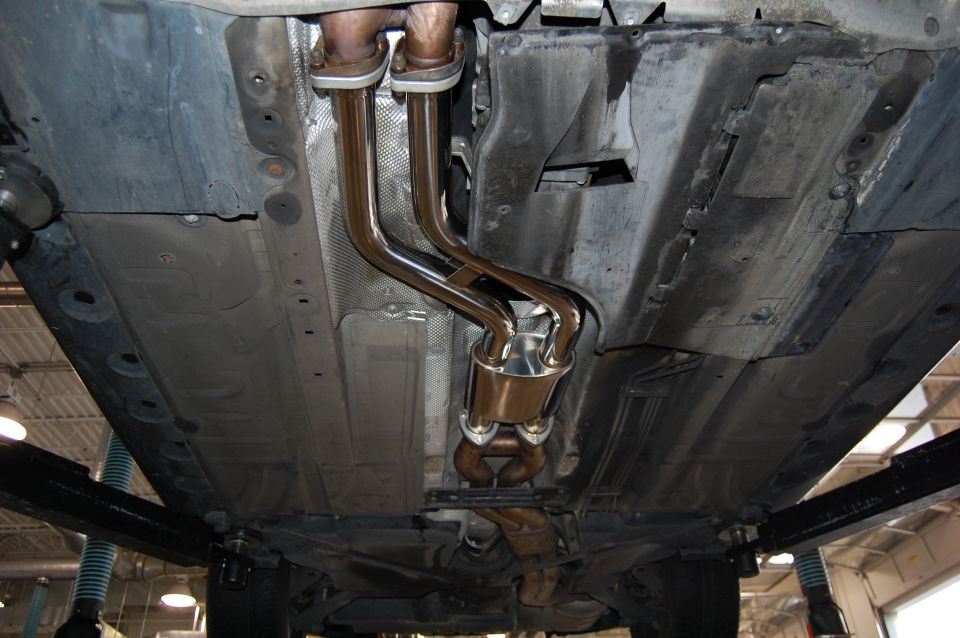 Underside view of a car's exhaust system and underbody components