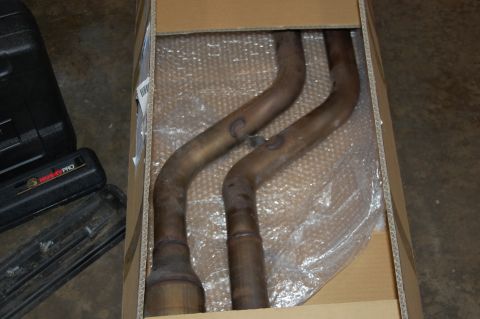 2002 BMW M3 - New exhaust pipes are packaged in a box, ready for installation.