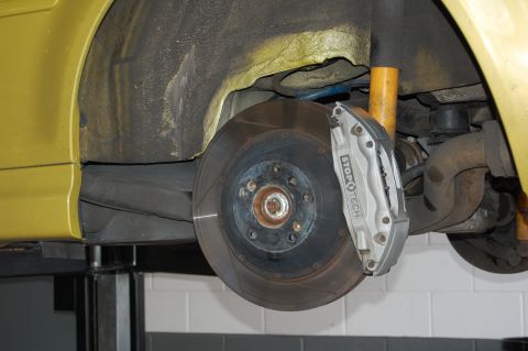 2002 BMW M3 - This photo shows the brake system of a vehicle, specifically the caliper and rotor, with visible 'StopTech' branding.