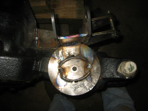 1995 Ford Bronco - Custom bracket welded onto a vehicle's axle assembly.