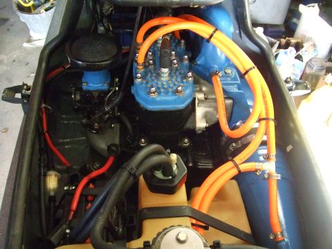 1998 Kawasaki JH1100-A4 1100 ZXi - Close-up view of a jet ski engine compartment, showing various hoses and components.