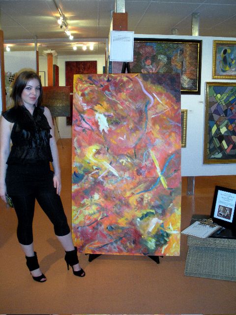 1989 Ford Bronco - Woman poses with an abstract artwork displayed in a gallery setting.