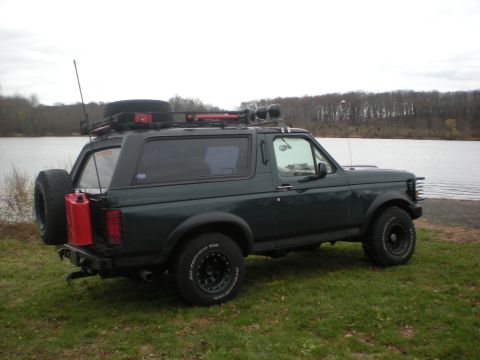 1993 Ford Bronco - This Ford Bronco is equipped for off-road adventures, a roof rack, spare tire, and auxiliary fuel can.