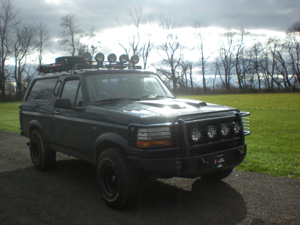 1993 Ford Bronco with roof rack, bull bar, and extra lights