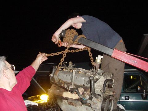 1987 Ford Bronco - as we were removing the motor my current(last resort)chain hook-up decided to start and slide down the motor lift. this is me fixing the pr…