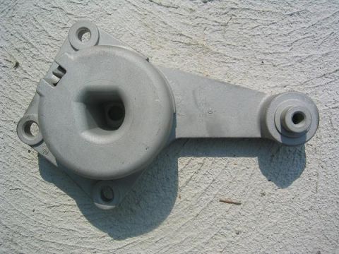 2007 Ford Mustang - Photograph of a cast aluminum accessory mounting bracket, a physical part not a technical document.