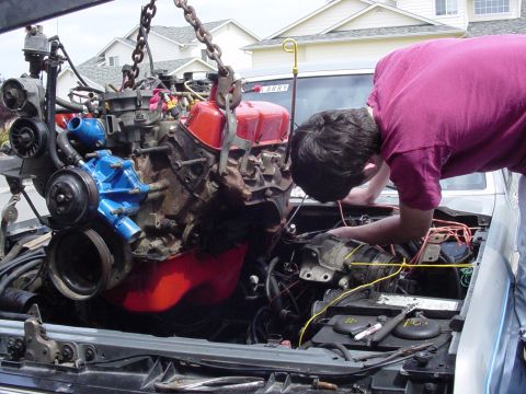 1987 Ford Bronco - pulling back the mess of wires to get the beast under the hood