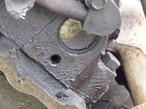 1987 Ford Bronco - close up of one of the leaking freeze plugs