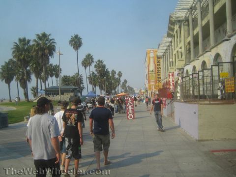 1968 Ford Mustang - Photograph of the Venice Beach boardwalk and shops, not a technical document.