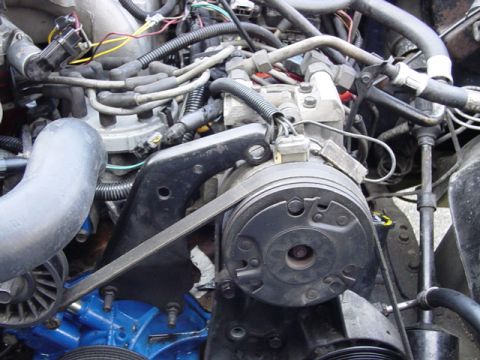 1987 Ford Bronco - this is just temporary, as you can see there are about three head bolts holding on my ac and power steering pump.