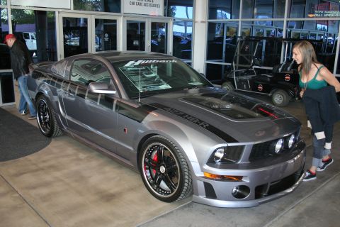 1998 Ford Crown Victoria - Photograph of a silver Roush Ford Mustang displayed at a car show, not a technical document.
