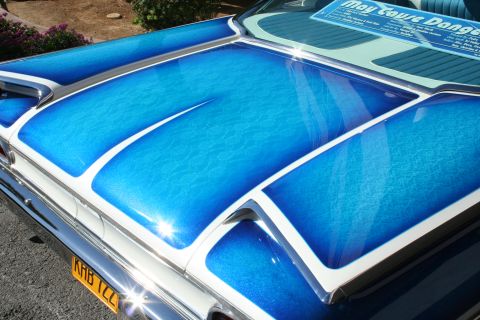 1998 Ford Crown Victoria - The blue vinyl interior of a car features white piping along the seams.
