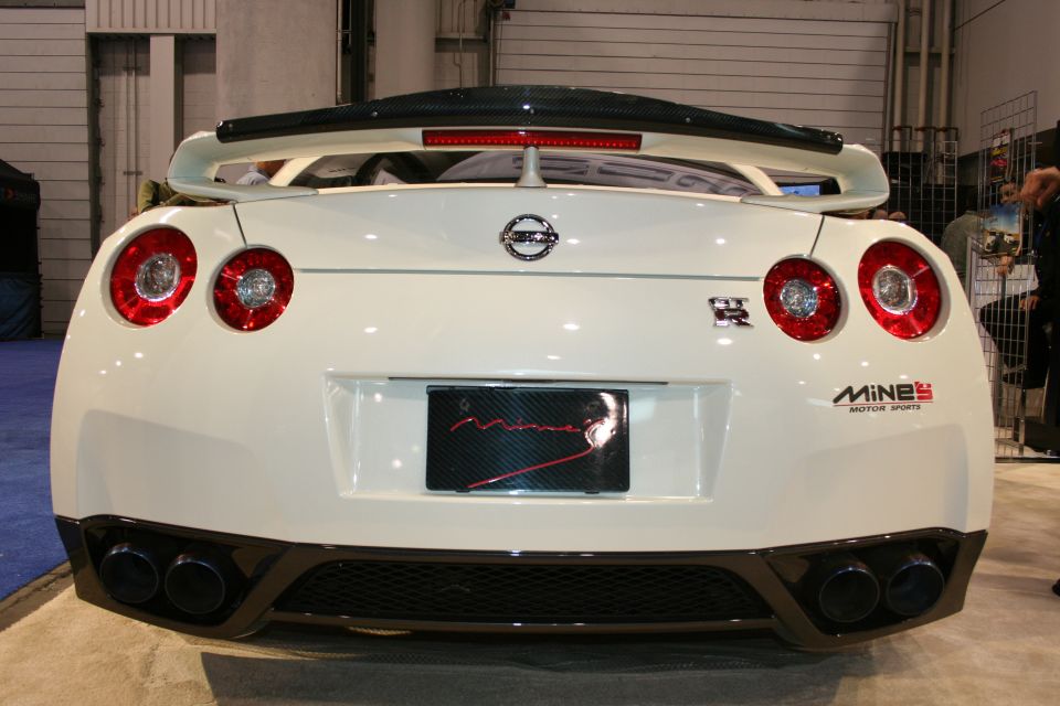 White Nissan GT-R rear view with quad exhaust and large spoiler