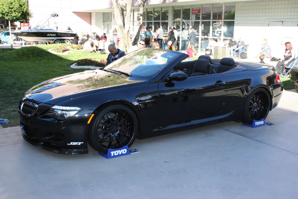 Black convertible with custom wheels and JST badging