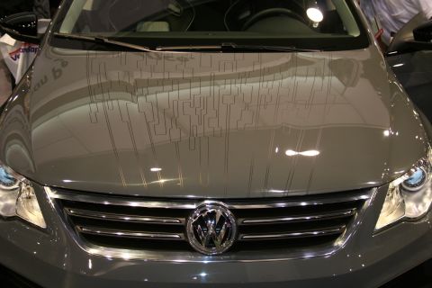 1998 Ford Crown Victoria - Front view of a gray Volkswagen with an abstract graphic design on the hood.