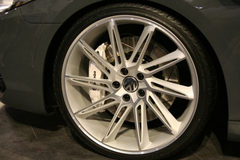1998 Ford Crown Victoria - Close-up of a car's wheel and tire, revealing a Volkswagen logo on the brake caliper.