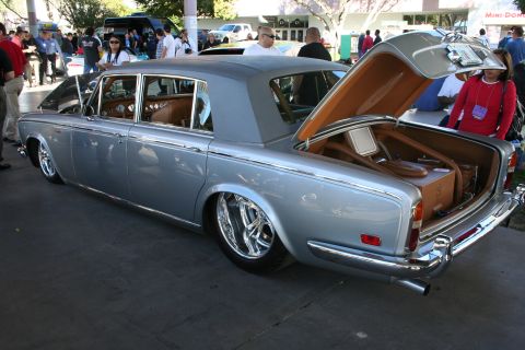 1998 Ford Crown Victoria - A silver Rolls-Royce with its trunk and hood open, its interior and custom wheels.