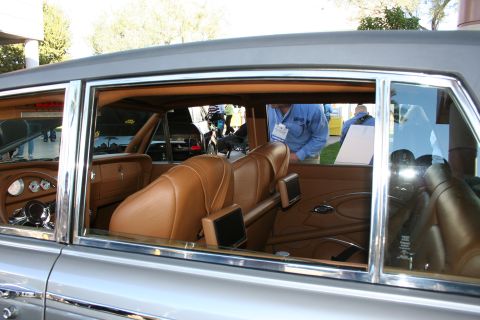 1998 Ford Crown Victoria - View of the custom interior of a classic car, tan leather upholstery and chrome accents.