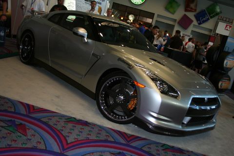 1998 Ford Crown Victoria - Modified Nissan GT-R on display with custom wheels and tires.