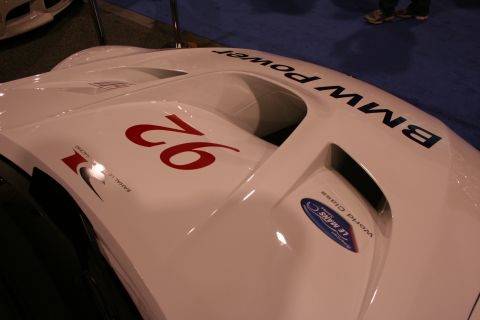 1998 Ford Crown Victoria - Close-up view of a white race car's hood, the number 92 and 'BMW Power' branding.