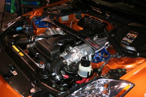 1998 Ford Crown Victoria - Customized engine bay aftermarket parts and vibrant orange paintwork.