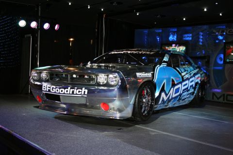 1998 Ford Crown Victoria - Custom race car with Mopar graphics and BFGoodrich tires on display.