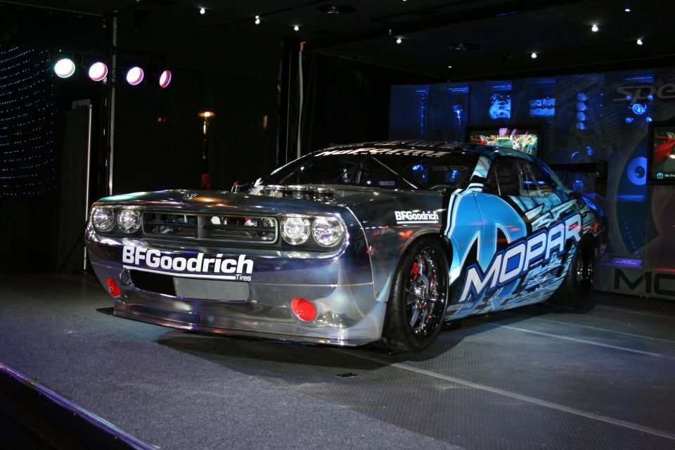 Race car with BFGoodrich and Mopar livery, chrome finish, exposed engine details