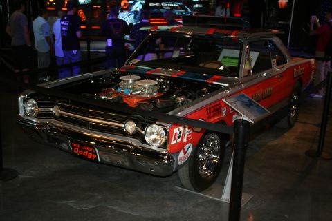 1998 Ford Crown Victoria - A vintage Dodge race car with its hood open, displaying its engine and racing decals.