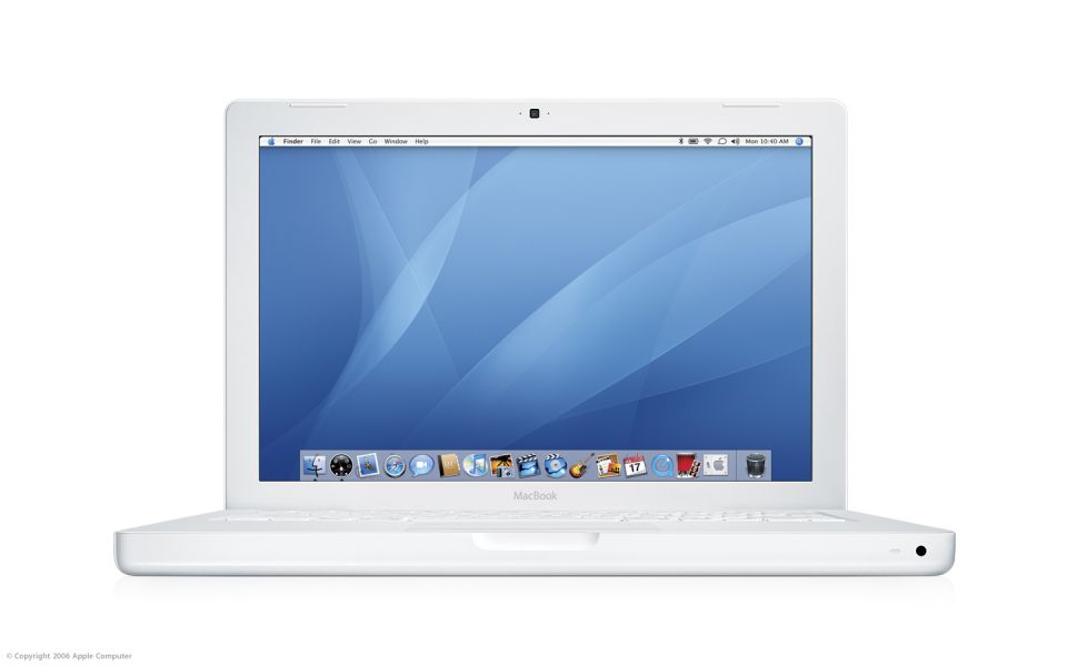 White MacBook laptop with blue wallpaper and dock visible on screen