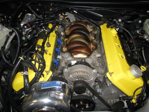 2003 Mercury Marauder - Close-up of a modified engine bay yellow valve covers and an aftermarket intake.