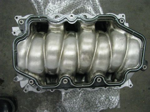 2003 Mercury Marauder - Close-up view of an engine's intake manifold, showing its internal structure and gasket seal.