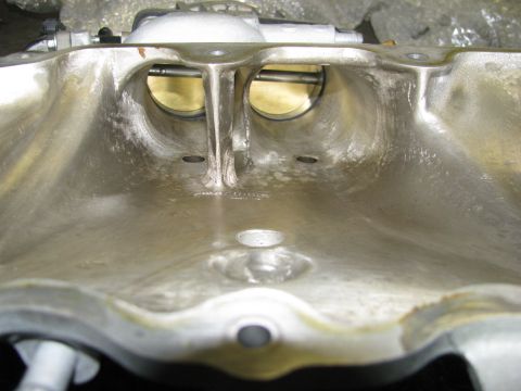 2003 Mercury Marauder - Inside view of an aluminum intake manifold, showing the dual throttle body openings and internal passages.