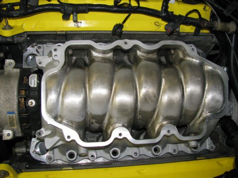 2003 Mercury Marauder - Engine intake manifold shown in detail, with yellow engine components in the background.