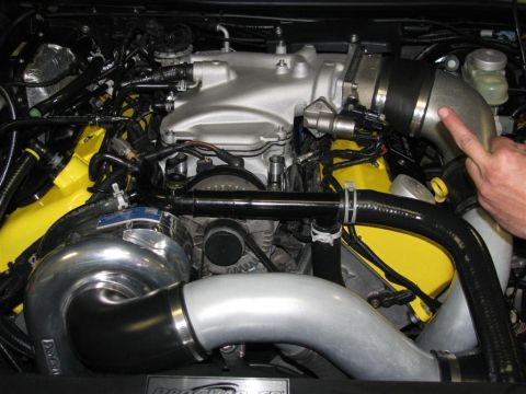 2003 Mercury Marauder - Close-up view of a modified engine a turbocharger and custom intake plumbing.