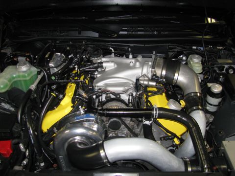 2003 Mercury Marauder - Customized engine bay with a prominent turbocharger and aftermarket intake components.