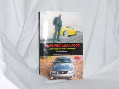 2007 Ford Mustang - This book cover displays two Ford Mustangs, one silver and one yellow, with text about John Coletti and Ford's 'Terminator'.