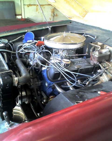 1968 Ford Bronco - Close-up of the engine compartment, a V8 engine with "Bronco" branding on the valve covers.